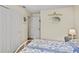 Bright bedroom with a cozy white metal bed, fresh paint, and a neutral color scheme for a relaxing retreat at 2525 W Ponkan Rd, Apopka, FL 32712