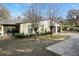 House featuring an attached two-car garage and a cozy screened in porch area for outdoor enjoyment at 2525 W Ponkan Rd, Apopka, FL 32712