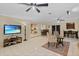 Spacious living room featuring tile flooring, ceiling fans and views to the kitchen at 2525 W Ponkan Rd, Apopka, FL 32712