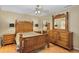 Traditional main bedroom with wood floors and a complete furniture set at 2525 W Ponkan Rd, Apopka, FL 32712