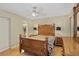 Traditional main bedroom with wood floors, ceiling fan and closet at 2525 W Ponkan Rd, Apopka, FL 32712