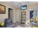 Comfortable seating area with TV, leading to mirrored closet and interior door at 2525 W Ponkan Rd, Apopka, FL 32712