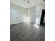 Bedroom with gray wood-look flooring and ceiling fan at 3428 Soho St # 308, Orlando, FL 32835