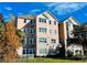 Charming condo building showcasing architectural details, lush landscaping and inviting curb appeal at 3428 Soho St # 308, Orlando, FL 32835