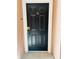 The unit's front door offers security and privacy within this well-maintained condominium community at 3428 Soho St # 308, Orlando, FL 32835