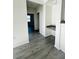 Hallway with desk area and gray wood-look flooring at 3428 Soho St # 308, Orlando, FL 32835