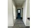 Hallway with gray wood-look flooring at 3428 Soho St # 308, Orlando, FL 32835