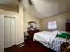 Bedroom features a large bed, wood floors, and a dresser with mirror at 3522 Wd Judge Dr, Orlando, FL 32808