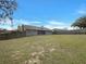Spacious backyard surrounded by a wooden fence at 3646 Dovetail S Ln, Lakeland, FL 33812
