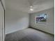 Bedroom with a ceiling fan, neutral paint, and a window at 3646 Dovetail S Ln, Lakeland, FL 33812