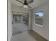 Bedroom with a ceiling fan, sliding glass door, and large windows at 3646 Dovetail S Ln, Lakeland, FL 33812