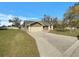 Charming single-story home featuring a two-car garage and concrete driveway at 3646 Dovetail S Ln, Lakeland, FL 33812