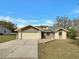 Charming single-story home featuring a two-car garage and well-maintained front yard at 3646 Dovetail S Ln, Lakeland, FL 33812