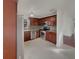 Modern kitchen with stainless steel appliances, granite countertops, and wood cabinetry at 3646 Dovetail S Ln, Lakeland, FL 33812
