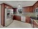 Well-equipped kitchen with stainless steel appliances and wooden cabinets at 3646 Dovetail S Ln, Lakeland, FL 33812