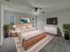 Spacious main bedroom with ceiling fan, big screen tv and modern decor at 3646 Dovetail S Ln, Lakeland, FL 33812
