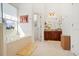 Bathroom with soaking tub under window, vanity and tiled floors at 3696 Peacepipe Ct, Clermont, FL 34711