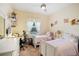 Bedroom with two twin beds, desk, and decor at 3696 Peacepipe Ct, Clermont, FL 34711