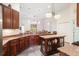 Open-concept kitchen with a center island and pendant lighting, great for entertaining at 3696 Peacepipe Ct, Clermont, FL 34711