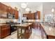 Gourmet kitchen featuring stainless steel appliances and center island with storage at 3696 Peacepipe Ct, Clermont, FL 34711