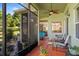 Relaxing screened-in patio area, great for entertaining, with ceiling fan and outdoor seating at 3696 Peacepipe Ct, Clermont, FL 34711