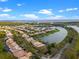 Panoramic aerial view of a beautiful lakeside residential area with scenic water views at 3850 Eagle Isle Cir, Kissimmee, FL 34746