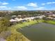 Aerial view of the community showcasing waterfront homes, docks, and lush landscaping at 3850 Eagle Isle Cir, Kissimmee, FL 34746