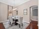 Elegant dining room with hardwood floors, modern chandelier, and stylish decor at 3850 Eagle Isle Cir, Kissimmee, FL 34746