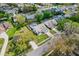 An aerial view of the property shows mature trees and a manicured lawn at 413 Country Wood Cir, Lake Mary, FL 32746