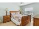 Bedroom with a queen-size bed, matching lamps and wooden nightstands at 413 Country Wood Cir, Lake Mary, FL 32746