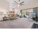 Open-concept living room with access to the kitchen and pool area at 413 Country Wood Cir, Lake Mary, FL 32746