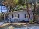 Well-maintained home with a charming front porch and lush landscaping at 500 E Crystal Lake St, Orlando, FL 32806