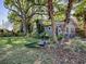 Beautiful home with mature landscaping and trees, including a peacock on the front lawn at 500 E Crystal Lake St, Orlando, FL 32806
