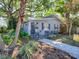 Charming home featuring well-manicured landscaping and a welcoming, grey exterior at 500 E Crystal Lake St, Orlando, FL 32806