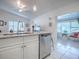 Bright kitchen featuring white cabinets, stainless steel appliances, and granite countertops at 500 E Crystal Lake St, Orlando, FL 32806