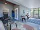 Charming lanai featuring comfortable seating, stylish decor, and serene backyard views, a perfect relaxing retreat at 500 E Crystal Lake St, Orlando, FL 32806