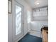 Well-lit laundry area with modern washer and dryer near the back door at 500 E Crystal Lake St, Orlando, FL 32806