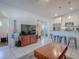 Bright living room with open layout connected to a modern kitchen and entryway at 500 E Crystal Lake St, Orlando, FL 32806