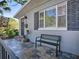 Inviting front porch with slate tile, seating, and decorative details at 500 E Crystal Lake St, Orlando, FL 32806
