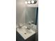 Clean bathroom featuring a modern sink, vanity, and well-lit mirror at 5317 Curry Ford Rd # Q104, Orlando, FL 32812