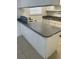 Bright kitchen featuring a breakfast bar with white cabinets and countertops at 5317 Curry Ford Rd # Q104, Orlando, FL 32812