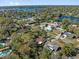 Aerial view of a residential neighborhood with lush greenery, nearby lakes, and well-maintained homes at 5325 Glasgow Ave, Orlando, FL 32819