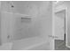 Updated bathroom featuring white tile shower, updated shower head, and white cabinets at 5325 Glasgow Ave, Orlando, FL 32819