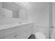 Bright bathroom with updated vanity, white cabinets, and a large mirror at 5325 Glasgow Ave, Orlando, FL 32819