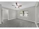 The bedroom features modern flooring, a window view, and easy bathroom access at 5325 Glasgow Ave, Orlando, FL 32819