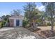 The house has a white exterior, brick accents, and a concrete driveway at 5325 Glasgow Ave, Orlando, FL 32819