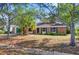 Cozy single-story brick home with mature trees in the front yard at 5325 Glasgow Ave, Orlando, FL 32819