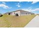 The backyard features a lawn and part of the home's exterior at 5996 Wildflower Field Way, St Cloud, FL 34771