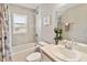 Bathroom featuring a tub, toilet, sink, and stylish tile at 5996 Wildflower Field Way, St Cloud, FL 34771
