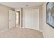 Bedroom with carpet, a closet, and a view into a connecting room at 5996 Wildflower Field Way, St Cloud, FL 34771